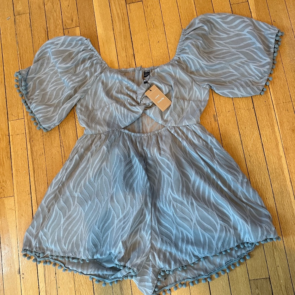 Grey green romper with tassel balls